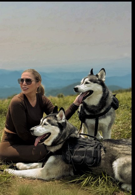 Post: Tracy with Luka and Sosa on a mountain bald